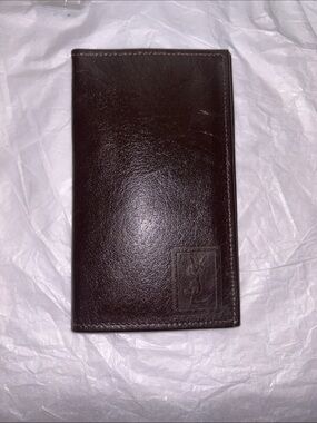 Yves Saint Laurent (YSL) vintage brown leather bifold wallet featuring an emboss